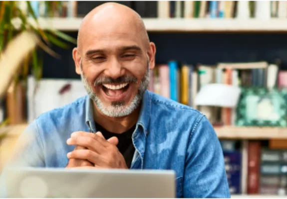 Man smiling at desk